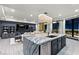 Open-concept living space with modern kitchen island, city views, and elegant decor at 9101 Alta Dr # 1206, Las Vegas, NV 89145