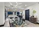 Open-concept living and dining area with modern lighting, floor-to-ceiling windows, and city views at 9101 Alta Dr # 1206, Las Vegas, NV 89145