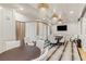 Bright meeting room featuring elegant chandeliers, modern decor, and a large-screen TV for presentations at 9101 Alta Dr # 1206, Las Vegas, NV 89145