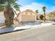 Inviting single-story home featuring desert landscaping, a two-car garage, and a well-maintained yard at , Las Vegas, NV 89107