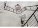 Open foyer with high ceilings, modern chandelier, views of the kitchen, and staircase at 10963 Mount Goyer St, Las Vegas, NV 89141