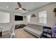 Cozy bonus room with a ceiling fan and carpeted floors, perfect for relaxation and entertainment at 10990 Mountain Willow St, Las Vegas, NV 89179