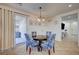 Cozy dining area with backyard access, stylish chairs, and neutral colors at 10990 Mountain Willow St, Las Vegas, NV 89179