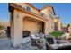 Charming outdoor living space with a covered patio, barbecue, and a cozy seating area for relaxing at 10990 Mountain Willow St, Las Vegas, NV 89179
