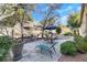Serene backyard with a patio, perfect for outdoor relaxation and entertaining with mature trees and a privacy wall at 1312 Rolling Sunset St, Henderson, NV 89052