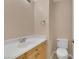 Simple bathroom features a vanity with a sink and a toilet at 1312 Rolling Sunset St, Henderson, NV 89052