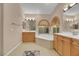 Bright bathroom boasts dual sinks, a large tub, and natural light at 1312 Rolling Sunset St, Henderson, NV 89052