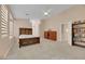 Spacious bedroom with light walls, ceiling fan, and carpet at 1312 Rolling Sunset St, Henderson, NV 89052