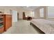 Bright, large bedroom with multiple windows and a ceiling fan at 1312 Rolling Sunset St, Henderson, NV 89052