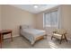 Bright bedroom features neutral decor, ceiling fan and an accent chair at 1312 Rolling Sunset St, Henderson, NV 89052