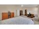 Open and airy bedroom showcasing neutral walls, ceiling fan, and carpet at 1312 Rolling Sunset St, Henderson, NV 89052