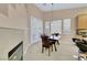 Dining area with fireplace and a window wall with views at 1312 Rolling Sunset St, Henderson, NV 89052