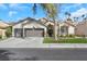 Charming single-story home features a well-manicured front yard and a spacious three-car garage at 1312 Rolling Sunset St, Henderson, NV 89052