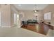 Spacious living room boasting tile and wood flooring, a ceiling fan, and plenty of natural light at 1312 Rolling Sunset St, Henderson, NV 89052