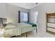 Inviting bedroom featuring bright window and tiled floor at 139 Serenade Ct, Henderson, NV 89074