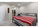 Spacious bedroom with neutral carpet, and a cozy bed adorned with decorative throw at 1410 Pink Dawn Dr, Henderson, NV 89014
