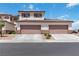 Charming two-story home with attached two-car garage and well-manicured landscaping at 1410 Pink Dawn Dr, Henderson, NV 89014