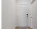 Clean white six-panel front door with digital lock at 1410 Pink Dawn Dr, Henderson, NV 89014