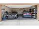 Spacious two-car garage with ample storage and clean epoxy flooring at 1410 Pink Dawn Dr, Henderson, NV 89014