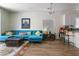 Comfortable living room with a sectional sofa, patterned rug, wooden floors, and bar stool seating at 1410 Pink Dawn Dr, Henderson, NV 89014