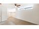 Bright bedroom featuring a ceiling fan, closet with shelving, and soft carpeting for added comfort at 1657 E Desert Inn Rd, Las Vegas, NV 89169