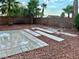 Attractive backyard with desert landscaping, pavers and a bench at 1960 Verbania Dr, Las Vegas, NV 89134