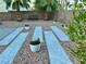 Inviting backyard with pavers, desert landscaping and potted plants at 1960 Verbania Dr, Las Vegas, NV 89134