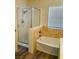 Bathroom featuring a shower and tub combination with stone look tile and a glass enclosure at 1960 Verbania Dr, Las Vegas, NV 89134