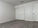 This bedroom features gray wood-look flooring and a spacious closet at 1960 Verbania Dr, Las Vegas, NV 89134