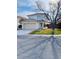 Charming two-story home with a well-kept lawn, attached garage, and mature tree at 1960 Verbania Dr, Las Vegas, NV 89134