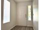 Inviting foyer featuring hardwood flooring, a bright window, and a secure front door at 1960 Verbania Dr, Las Vegas, NV 89134