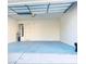 An empty two-car garage featuring painted floors and walls at 1960 Verbania Dr, Las Vegas, NV 89134