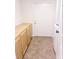 Bright laundry room featuring ample cabinet space and linoleum flooring at 1960 Verbania Dr, Las Vegas, NV 89134