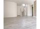 Spacious living area with sleek hardwood flooring, modern staircase, and ample natural light at 1960 Verbania Dr, Las Vegas, NV 89134