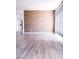 Open-concept living room boasting hardwood floors, textured accent wall, and bright window at 1960 Verbania Dr, Las Vegas, NV 89134