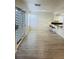 Living room with wood floors, access to back yard and kitchen bar seating at 1960 Verbania Dr, Las Vegas, NV 89134