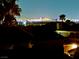 A captivating night view of the glittering city skyline from a rooftop at 1960 Verbania Dr, Las Vegas, NV 89134