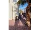 Narrow side yard featuring decorative rock covering, statue and mature palm tree at 1960 Verbania Dr, Las Vegas, NV 89134