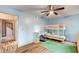 Well-lit bedroom with bunk beds, a ceiling fan, and wood flooring at 2641 Ruthe Duarte Ave, Las Vegas, NV 89121