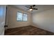 Cozy bedroom featuring wood-look flooring and a large window at 2851 S Valley View Blvd # 1098, Las Vegas, NV 89102