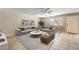 Bright, staged living room showcasing neutral decor, tile flooring, and natural light at 328 S Buffalo Dr # 101, Las Vegas, NV 89145