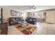 Comfortable living room featuring neutral walls, ceiling fan, and tile and wood floors at 328 S Buffalo Dr # 101, Las Vegas, NV 89145