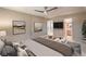 Spacious bedroom featuring a ceiling fan, and a view into a connected bathroom at 328 S Buffalo Dr # 101, Las Vegas, NV 89145