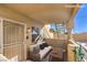 Virtually staged patio with a sofa and table, offering a cozy outdoor living space at 328 S Buffalo Dr # 101, Las Vegas, NV 89145