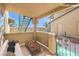 Virtually staged patio featuring outdoor seating with a view of the neighborhood at 328 S Buffalo Dr # 101, Las Vegas, NV 89145