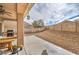Expansive backyard featuring desert landscaping and an outdoor patio with barbecue, perfect for entertaining guests at 3305 Fernbird Ln, North Las Vegas, NV 89084
