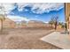 Low maintenance backyard with gravel landscaping, patio, and fencing for privacy at 3305 Fernbird Ln, North Las Vegas, NV 89084