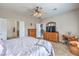 Bedroom featuring carpet, a ceiling fan, and dressers at 3305 Fernbird Ln, North Las Vegas, NV 89084