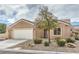 Charming single-story home featuring desert landscaping, a two-car garage, and a tile roof at 3305 Fernbird Ln, North Las Vegas, NV 89084