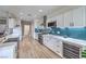 Bright kitchen featuring white cabinets, stainless steel appliances, and a stylish backsplash at 3305 Fernbird Ln, North Las Vegas, NV 89084